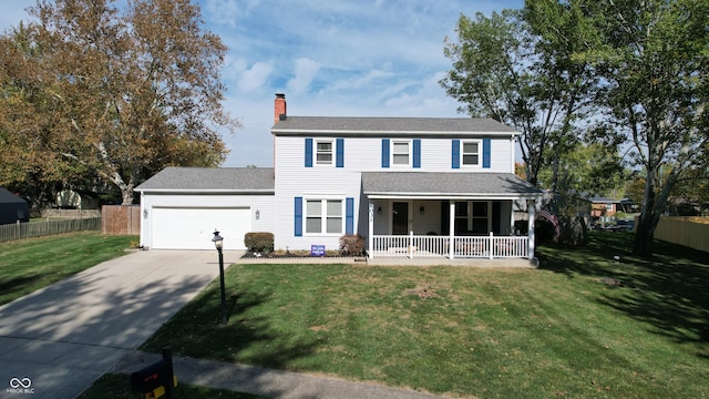 view of front of house with a garage, covered porch, and a front yard