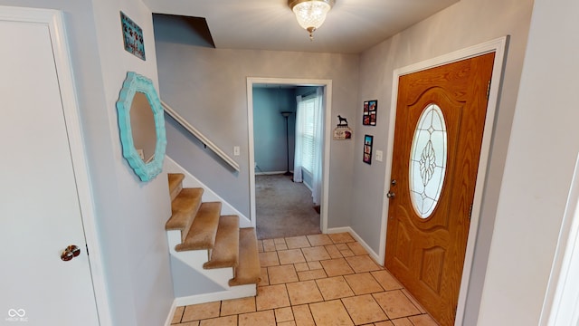 view of carpeted foyer