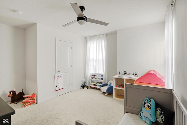 game room featuring carpet flooring and ceiling fan