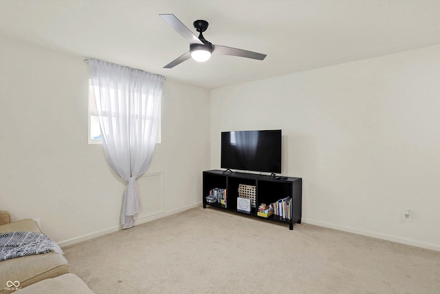 carpeted living room featuring ceiling fan