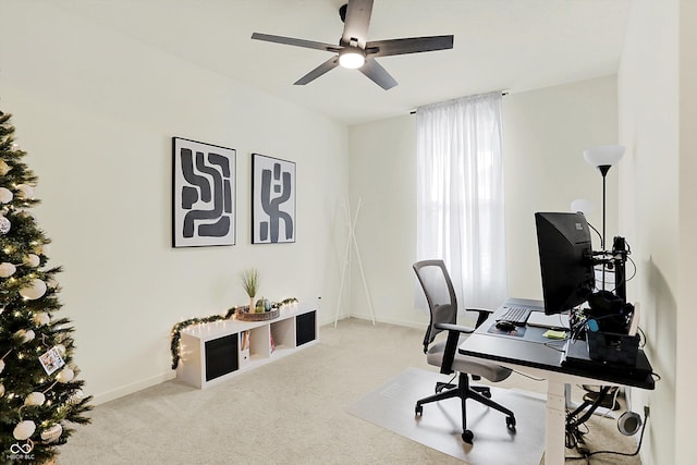 office with light carpet and ceiling fan