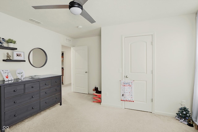 bedroom featuring light colored carpet and ceiling fan