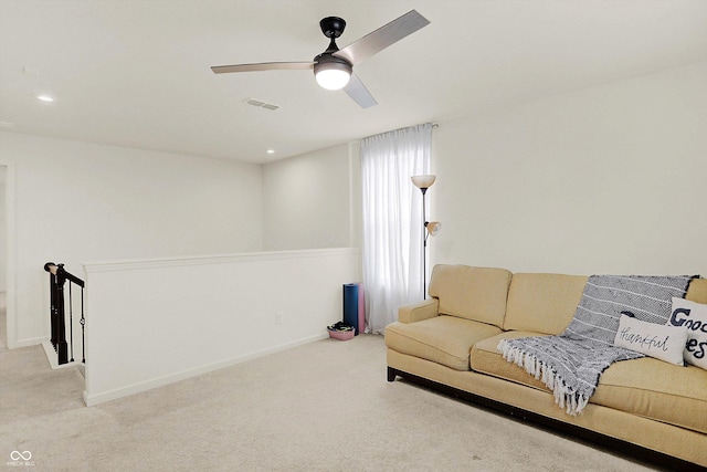 living room with light carpet and ceiling fan