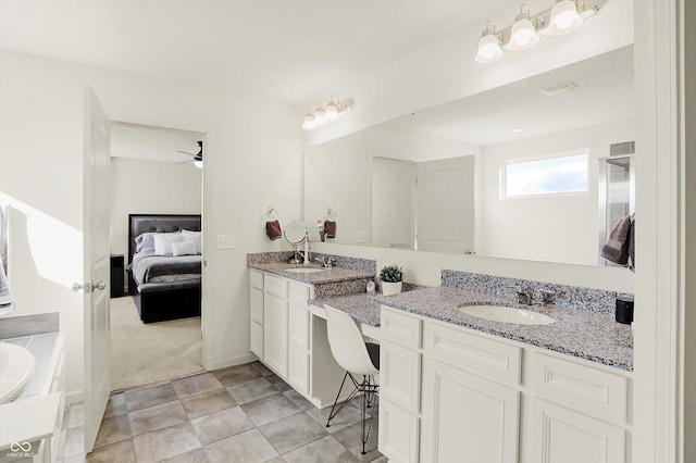 bathroom featuring ceiling fan and vanity