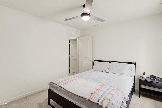 bedroom featuring light carpet and ceiling fan