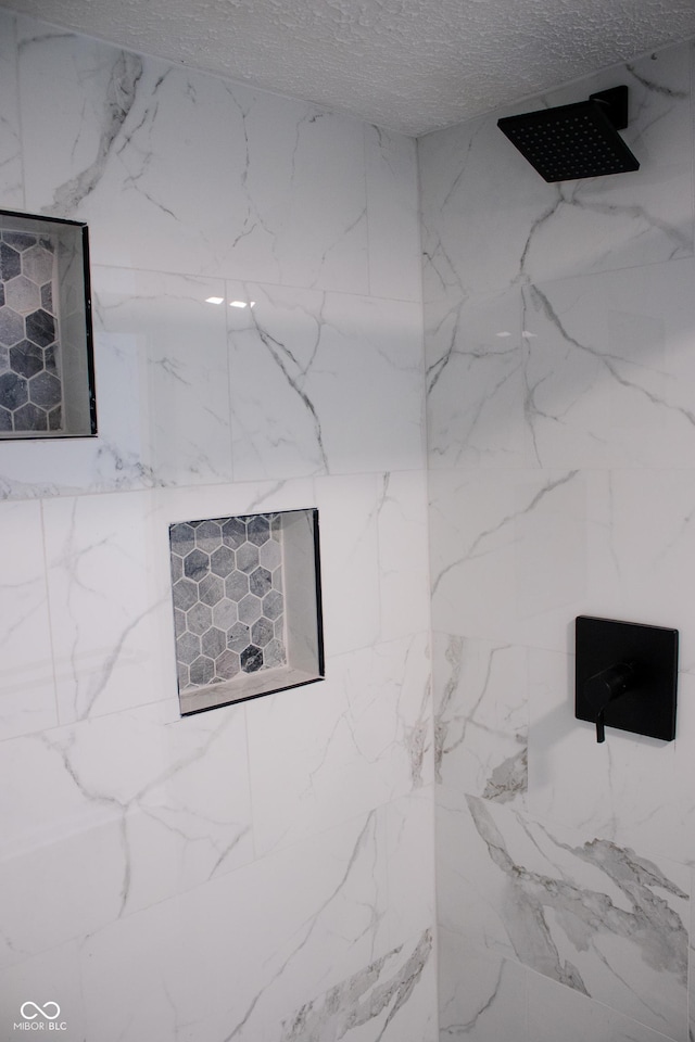 interior details with a tile shower