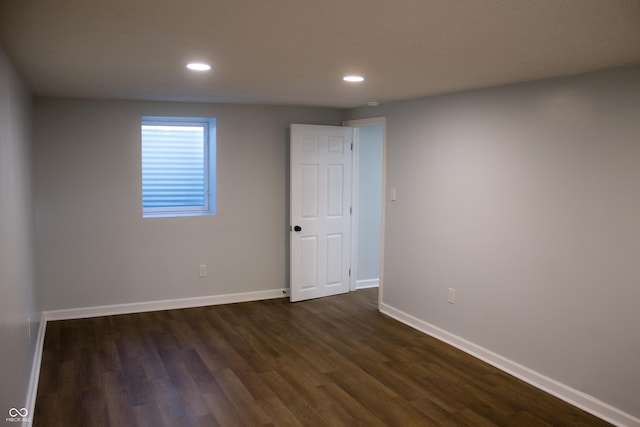 spare room featuring dark hardwood / wood-style floors