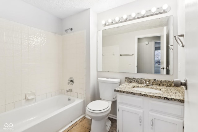 full bathroom with toilet, a textured ceiling, shower / bath combination, tile patterned flooring, and vanity