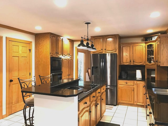 kitchen featuring black microwave, a center island, stainless steel fridge with ice dispenser, a kitchen bar, and light tile patterned flooring