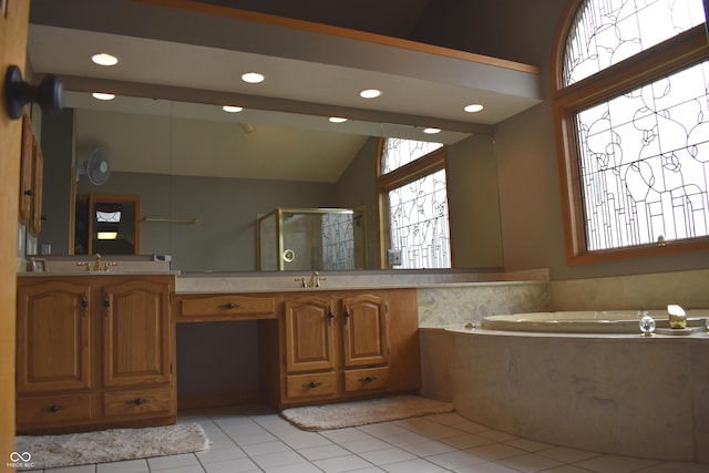 bathroom featuring tile patterned flooring, shower with separate bathtub, vanity, and lofted ceiling