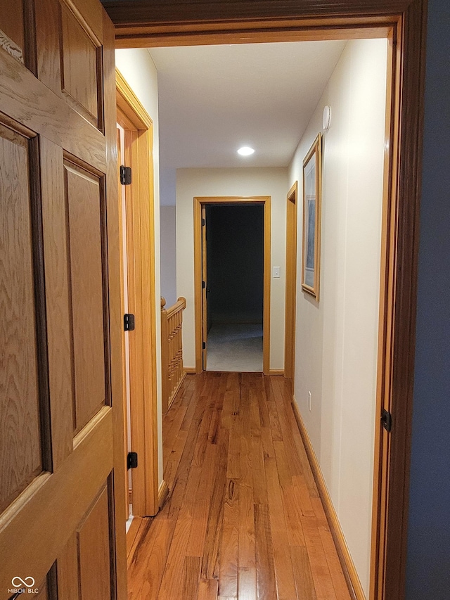 hall with light hardwood / wood-style flooring