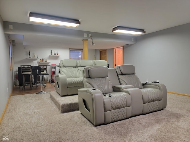 home theater room with light carpet