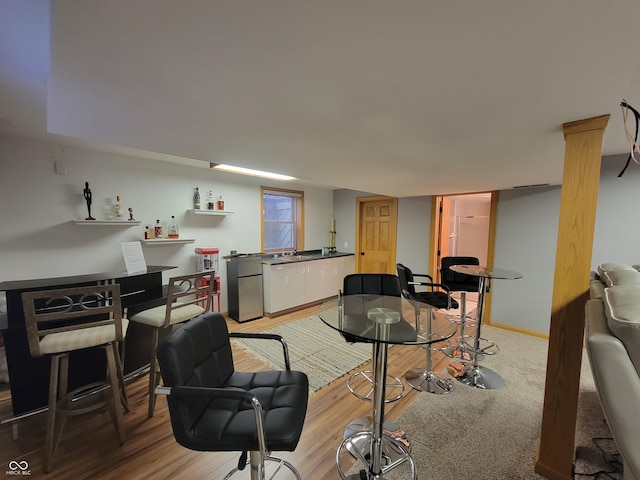 dining area with hardwood / wood-style floors