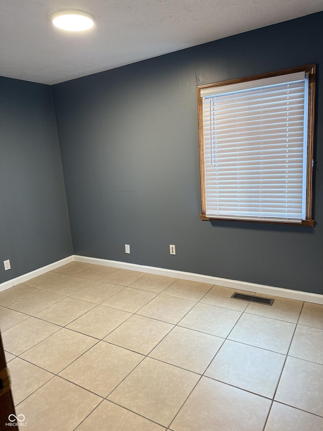 view of tiled spare room