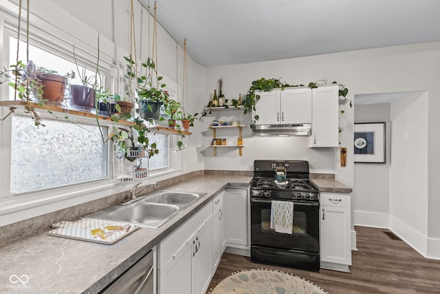 kitchen featuring gas stove, white cabinetry, sink, and a healthy amount of sunlight