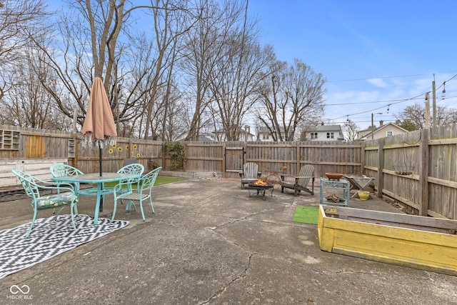 view of patio / terrace featuring a fire pit