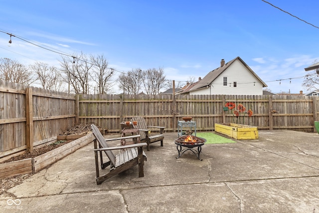 view of patio / terrace with an outdoor fire pit