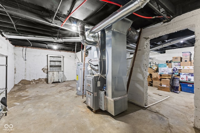 basement with electric water heater and heating unit