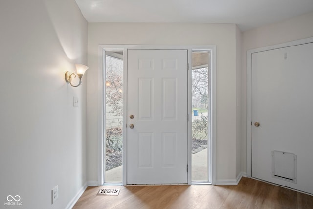 foyer entrance featuring hardwood / wood-style floors