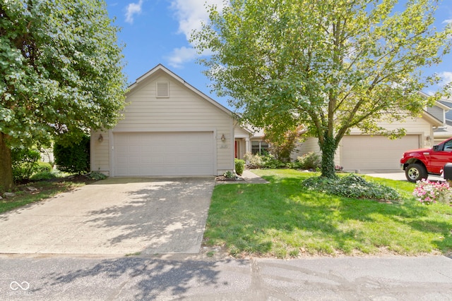 view of front of house featuring a front yard and a garage