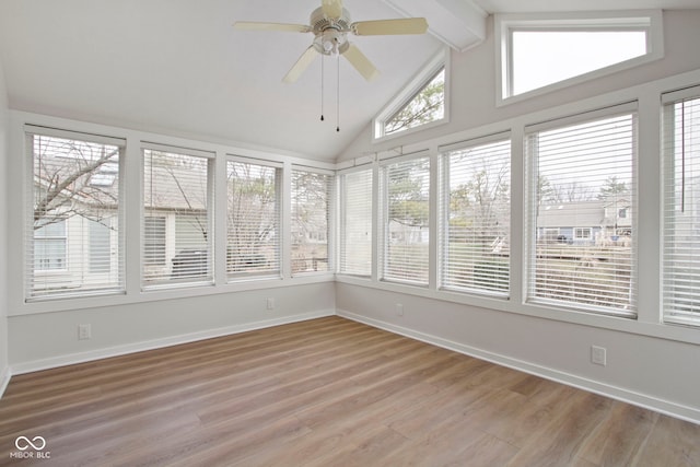 unfurnished sunroom with ceiling fan and lofted ceiling with beams