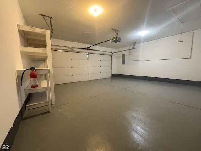 garage with electric panel and a garage door opener