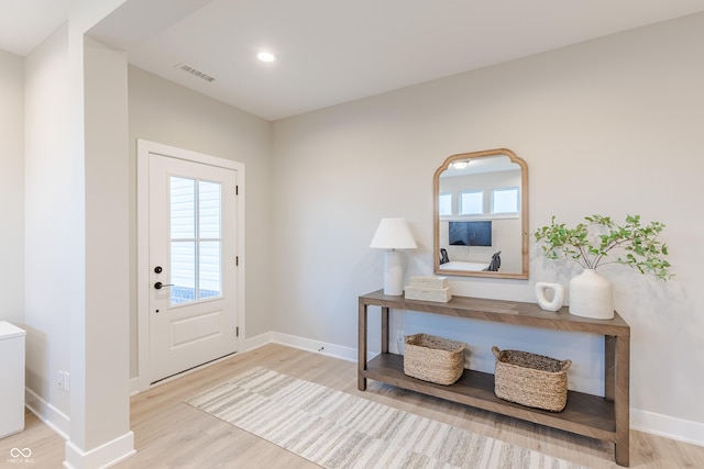 foyer with light wood-type flooring