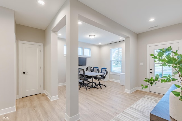 office space with light hardwood / wood-style floors