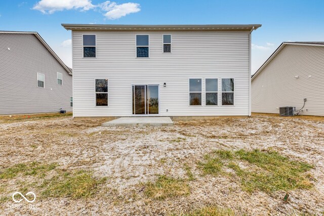 rear view of house featuring a patio and central AC unit