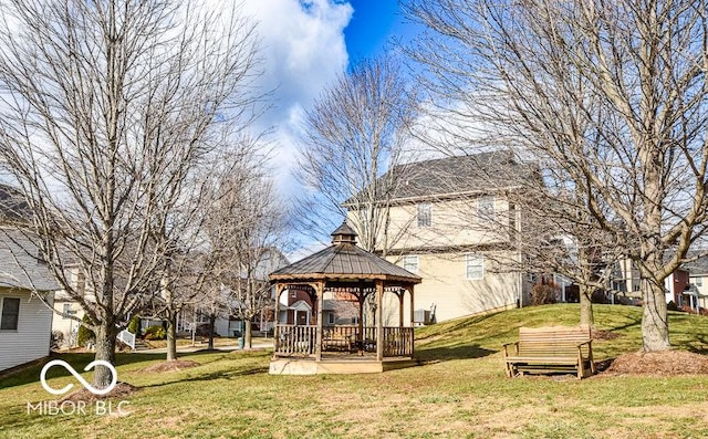 surrounding community with a gazebo and a lawn