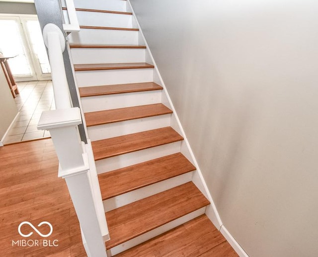 stairs with wood-type flooring