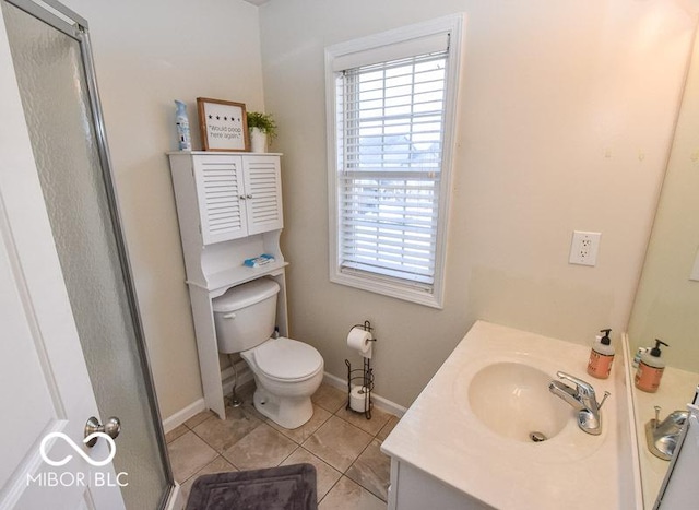 bathroom with tile patterned floors, vanity, toilet, and a shower with door