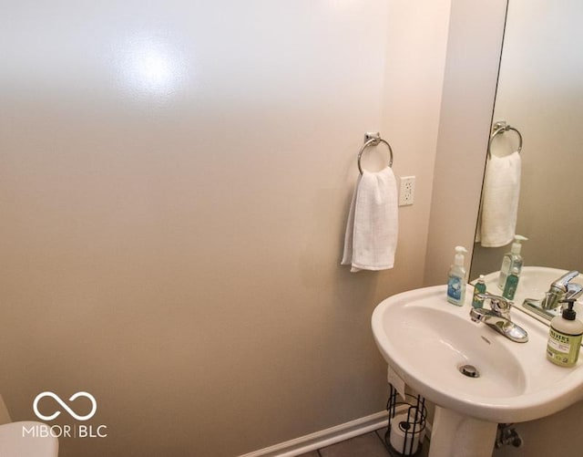 bathroom featuring sink and tile patterned flooring