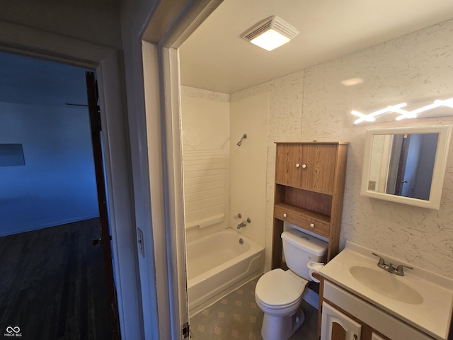 full bathroom featuring vanity, bathtub / shower combination, and toilet