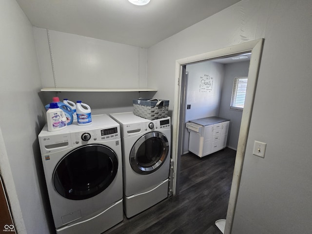 clothes washing area with washer and dryer and dark hardwood / wood-style floors