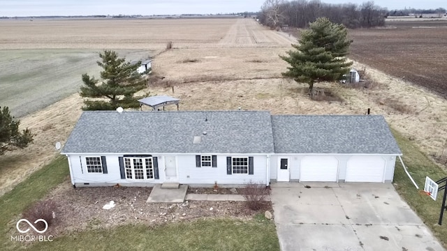 birds eye view of property with a rural view