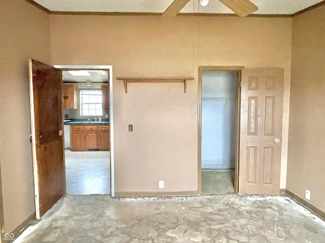 unfurnished bedroom featuring sink and a closet