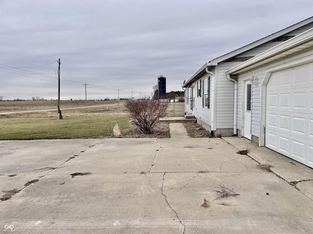 view of property exterior with a yard