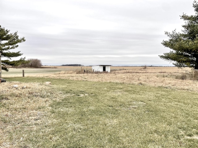 view of yard with a rural view