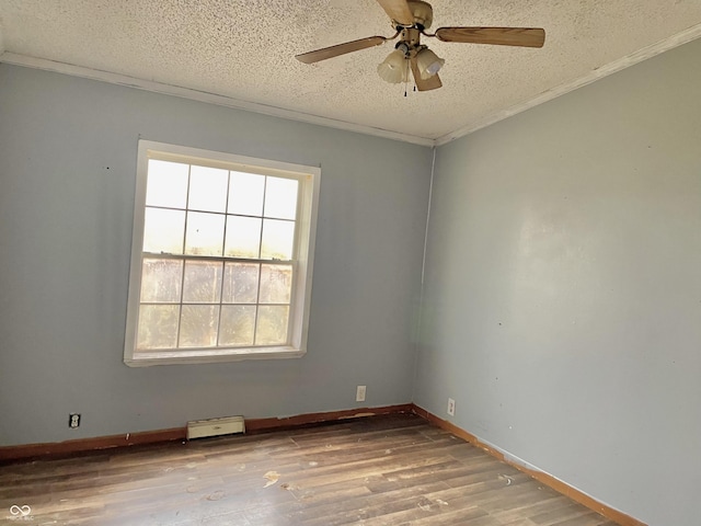 spare room with a textured ceiling, ceiling fan, crown molding, and light hardwood / wood-style floors