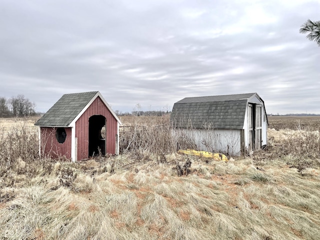 view of outbuilding featuring a rural view