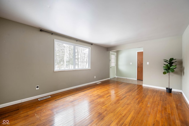 spare room with light wood-type flooring