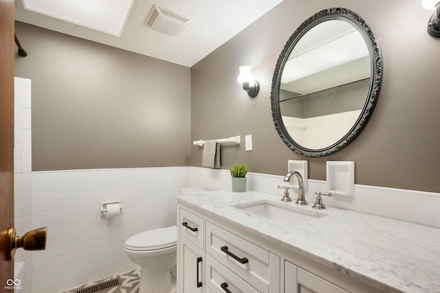 bathroom with tile patterned floors, toilet, and vanity