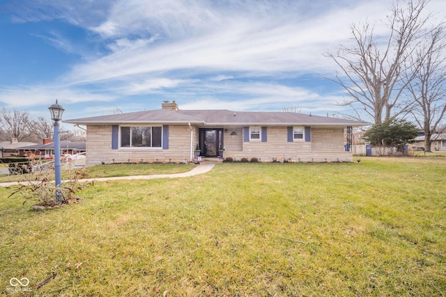 single story home featuring a front lawn