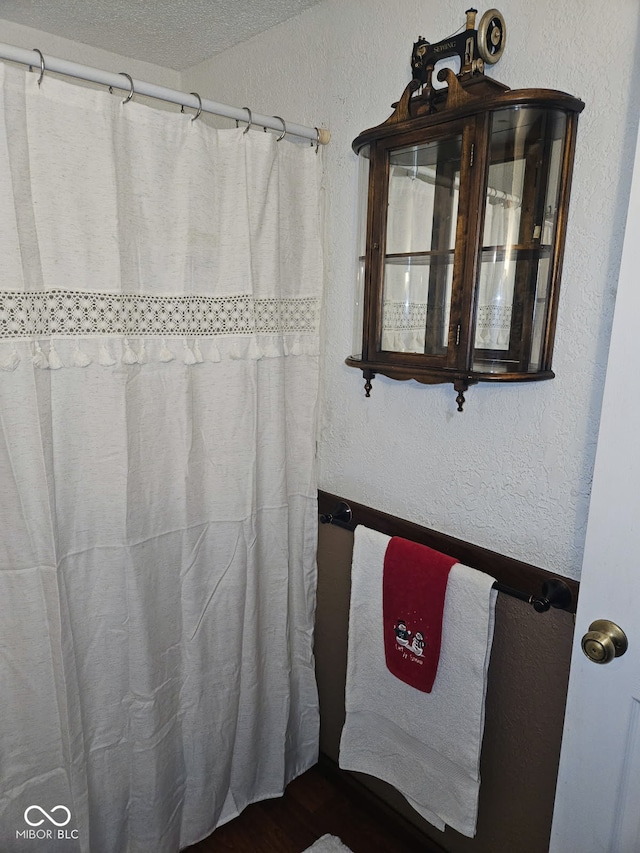 bathroom with a textured ceiling