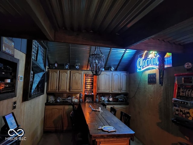 office featuring a chandelier and lofted ceiling with beams