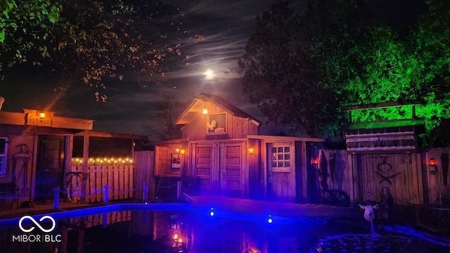 exterior space with a fenced in pool