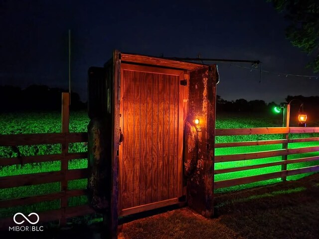 view of gate at night