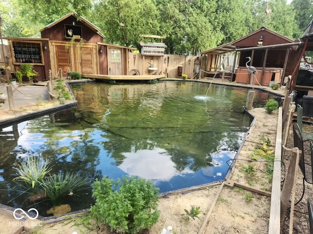 view of pool featuring a hot tub