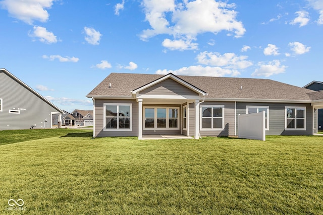 16689 Cattle Hollow Ln, Noblesville, IN 46060 - rear view of property featuring a lawn, roof with shingles, and a patio area
